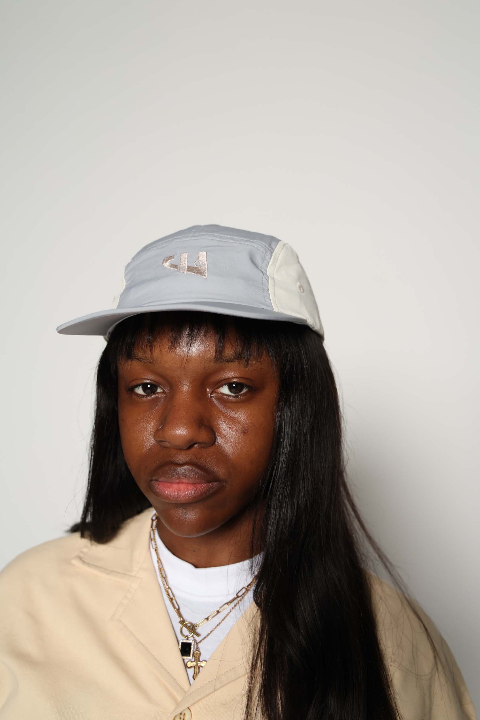 £ Cap
